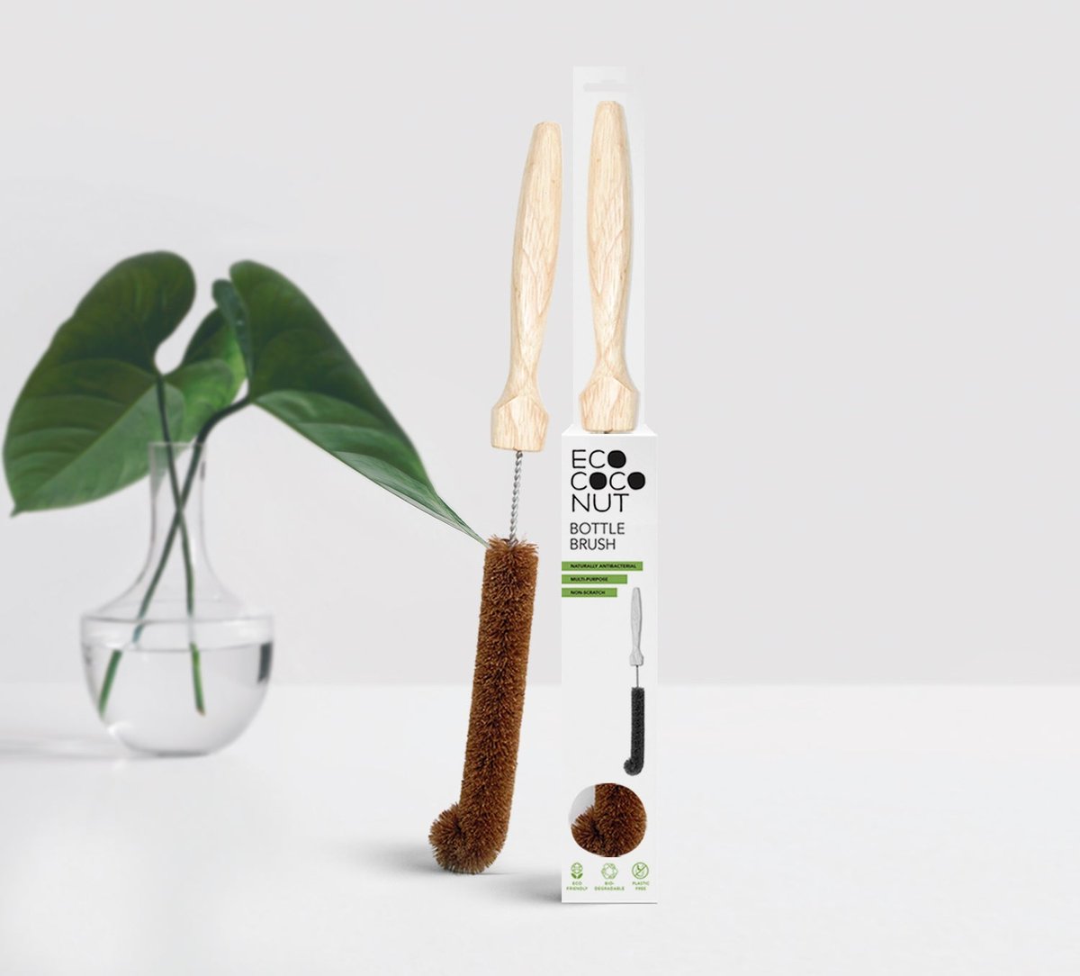 EcoCoconut Bottle Brush with wooden handle and coconut-coir bristles beside its retail packaging