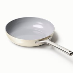 Caraway ceramic nonstick fry pan in Cream with stainless handle, angled view