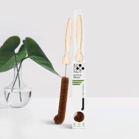 EcoCoconut Bottle Brush with wooden handle and coconut-coir bristles beside its retail packaging