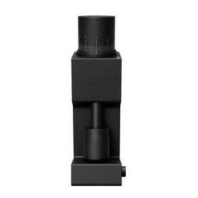 Varia VS6 electric coffee grinder in black, front view with the magnetic dosing cup in place